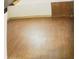 Simple bedroom with wood-look flooring and a door at 1108 Burdsal Pkwy, Indianapolis, IN 46208