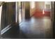 Dark hallway with tile floor and access to other rooms at 1108 Burdsal Pkwy, Indianapolis, IN 46208