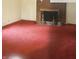 Living room with brick fireplace and red carpet at 1108 Burdsal Pkwy, Indianapolis, IN 46208