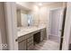 Double vanity bathroom with gray cabinets and quartz countertop at 10257 Meadow Path Ln, Indianapolis, IN 46239