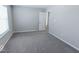 Bright bedroom featuring gray carpet and a window at 10257 Meadow Path Ln, Indianapolis, IN 46239