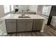 Kitchen island with double sink and stainless steel dishwasher at 10257 Meadow Path Ln, Indianapolis, IN 46239