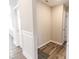 View of a hallway with wood-look floors and neutral walls at 10257 Meadow Path Ln, Indianapolis, IN 46239