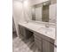 Double vanity bathroom with gray cabinets and quartz countertop at 10257 Meadow Path Ln, Indianapolis, IN 46239