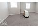 Simple bedroom with gray carpeting and neutral walls at 10257 Meadow Path Ln, Indianapolis, IN 46239