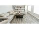 Living room with sectional sofa and kitchen view at 10257 Meadow Path Ln, Indianapolis, IN 46239