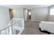 Spacious loft with gray carpet, neutral walls, and white trim at 10257 Meadow Path Ln, Indianapolis, IN 46239