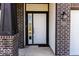 White front door with black trim and a sidelight window at 10257 Meadow Path Ln, Indianapolis, IN 46239