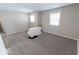 Simple bedroom with gray carpeting and neutral walls at 10257 Meadow Path Ln, Indianapolis, IN 46239