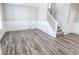 Gray wood-look floors and white wainscoting at 10257 Meadow Path Ln, Indianapolis, IN 46239