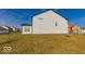 Spacious backyard with grassy area and view of neighboring homes at 10257 Meadow Path Ln, Indianapolis, IN 46239
