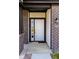White front door with black trim and a sidelight window at 10257 Meadow Path Ln, Indianapolis, IN 46239