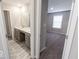 Bathroom with double vanity and a view of a bedroom at 10257 Meadow Path Ln, Indianapolis, IN 46239