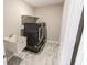 Laundry room with washer, dryer, and utility sink at 10257 Meadow Path Ln, Indianapolis, IN 46239