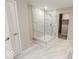 Large walk-in shower with marble tile and glass enclosure at 10257 Meadow Path Ln, Indianapolis, IN 46239