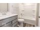 Bathroom with gray vanity, bathtub, and wood-look floors at 10257 Meadow Path Ln, Indianapolis, IN 46239