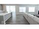 Spacious living room with hardwood floors and sectional sofa at 10257 Meadow Path Ln, Indianapolis, IN 46239