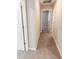 Hallway with carpet and access to bedrooms at 10257 Meadow Path Ln, Indianapolis, IN 46239