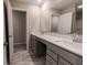 Double vanity bathroom with gray cabinets and quartz countertop at 10257 Meadow Path Ln, Indianapolis, IN 46239