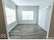 Bright dining room with hardwood floors and window blinds at 10257 Meadow Path Ln, Indianapolis, IN 46239