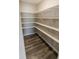 Bright walk-in pantry with white shelves at 10257 Meadow Path Ln, Indianapolis, IN 46239
