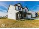 Two-story home with white siding, dark accents, and a covered porch at 10257 Meadow Path Ln, Indianapolis, IN 46239