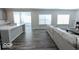 Spacious living room with hardwood floors and sectional sofa at 10257 Meadow Path Ln, Indianapolis, IN 46239