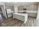 Modern kitchen with gray cabinets, quartz countertops, and stainless steel appliances at 10257 Meadow Path Ln, Indianapolis, IN 46239