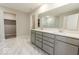 Bathroom featuring a double vanity and marble floors at 10257 Meadow Path Ln, Indianapolis, IN 46239