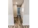 Light-filled hallway with wood-look floors and neutral walls at 10257 Meadow Path Ln, Indianapolis, IN 46239