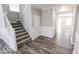 Gray wood-look floors and white wainscoting at 10257 Meadow Path Ln, Indianapolis, IN 46239