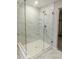 Spacious shower with marble tile and glass doors at 10257 Meadow Path Ln, Indianapolis, IN 46239
