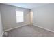 Simple bedroom with carpet and a door at 10257 Meadow Path Ln, Indianapolis, IN 46239