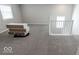 Loft bedroom with gray carpet, neutral walls, and white trim at 10257 Meadow Path Ln, Indianapolis, IN 46239