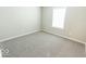 Spacious bedroom with neutral gray carpet and large window at 10257 Meadow Path Ln, Indianapolis, IN 46239