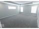 Large main bedroom with grey carpet and multiple windows at 10257 Meadow Path Ln, Indianapolis, IN 46239