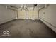 Two-car garage with overhead storage and ample space at 905 Crescent Dr, Anderson, IN 46013