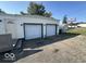 Two-car garage with driveway and additional exterior storage at 905 Crescent Dr, Anderson, IN 46013
