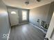 Spacious laundry room with updated flooring and plumbing at 905 Crescent Dr, Anderson, IN 46013