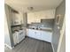 Updated kitchen, white cabinets, and new flooring at 905 Crescent Dr, Anderson, IN 46013