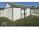 White shed with green trim in backyard at 905 Crescent Dr, Anderson, IN 46013