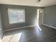 Bright living room with gray walls and vinyl flooring at 905 Crescent Dr, Anderson, IN 46013