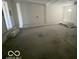 Attached garage with extra storage and concrete floor at 905 Crescent Dr, Anderson, IN 46013