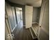 Clean hallway with updated flooring and storage at 905 Crescent Dr, Anderson, IN 46013