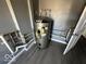 Large utility closet with water heater and plumbing at 905 Crescent Dr, Anderson, IN 46013