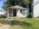 Small bungalow with a covered porch and AC unit at 1108 Burdsal Pkwy, Indianapolis, IN 46208
