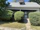 Charming one-story home with a covered porch and well-manicured landscaping at 1108 Burdsal Pkwy, Indianapolis, IN 46208