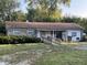 Brick ranch home with a ramp and mature landscaping at 6602 Lennington Dr, Indianapolis, IN 46226