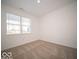 Simple bedroom with neutral carpeting and a large window at 6195 Madera Dr, Whitestown, IN 46075