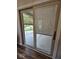 Sliding glass door with integrated blinds leading to a patio at 2170 Galleone Way, Plainfield, IN 46168